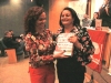 Laudiceia Ferreira (ex-monitora) recebendo o Livro, de Mara Cruz